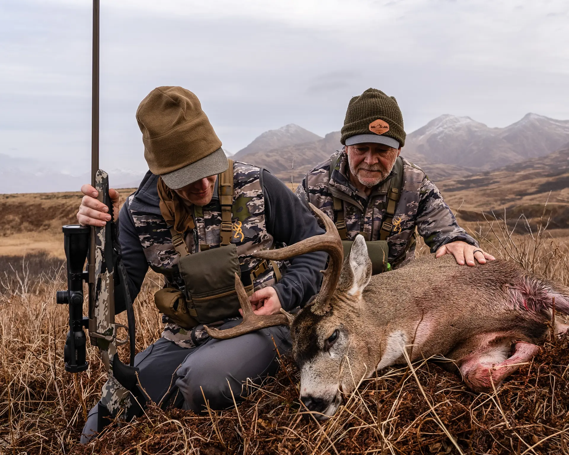 two hunters with a deer