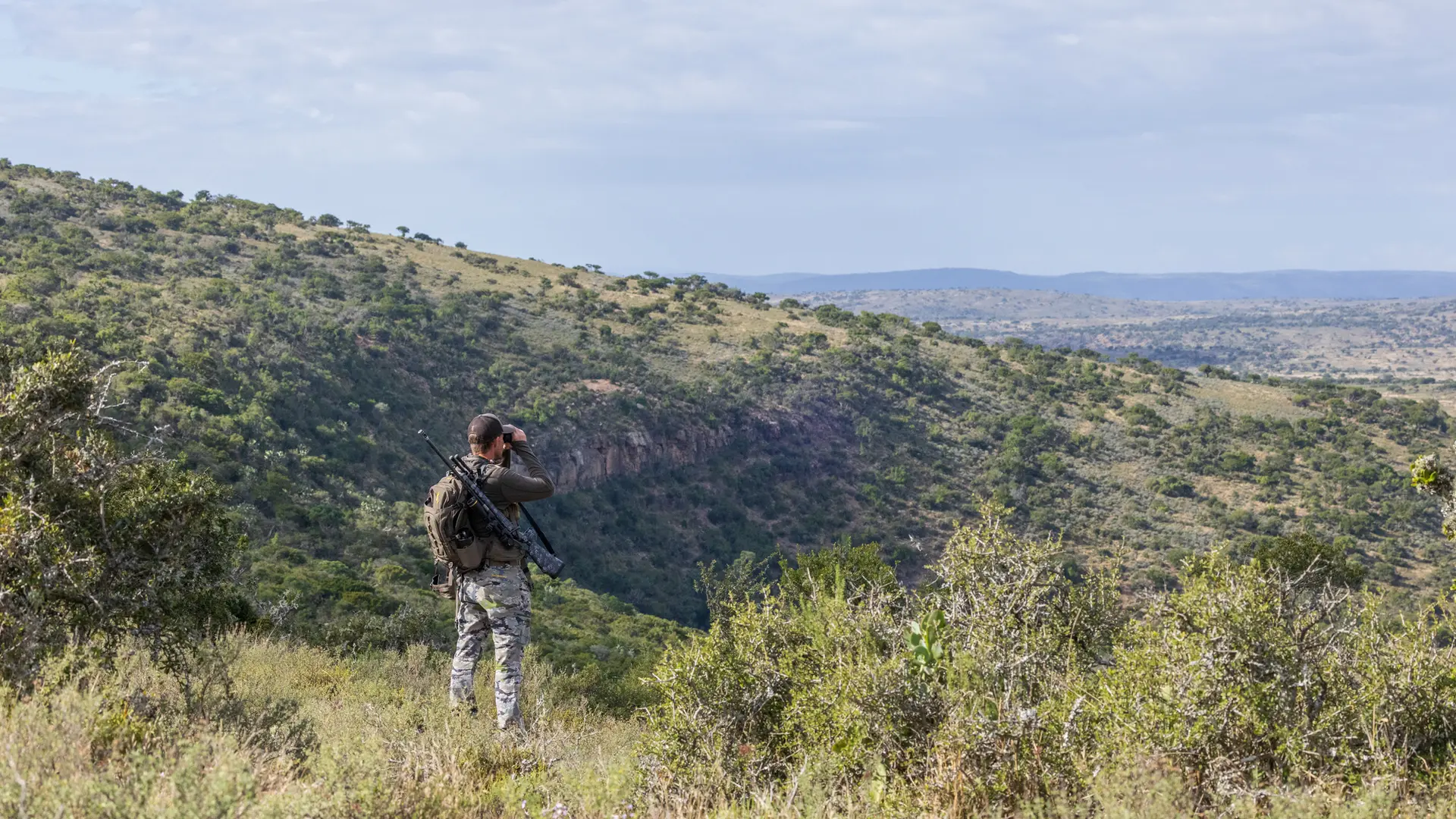 hunter looking over a ridge