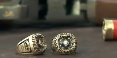 Matt and Fosters trophy rings on table