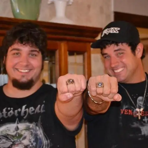 Matt and Foster showing off trophy rings